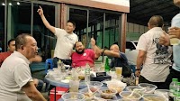 A Thai village chief invited dozens of cops for dinner. Then he allegedly told his henchman to kill one