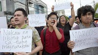 Protesters vow to exhume remains