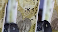 Rupee slips as Asia FX rally cools; correlation with yuan tightens