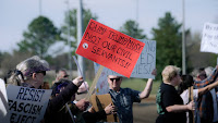 Protesters gather outside Redstone Arsenal, voicing support for federal workers