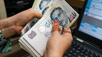 Singapore dollar exhibits safe-haven currency features. But it's no yen or Swiss franc — yet