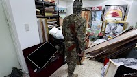 From book on Russian military to pills: What rebels found in Assad's palace