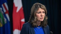 Alberta premier faces raucous, angry town hall on province's coal policy