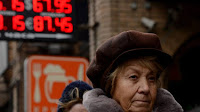 Russia's ruble drops to more than a 2-year low against the dollar on fresh sanctions and surging tensions