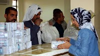 News - First Day of Dinar Exchange Proceeds Smoothly, Represents Big Step in Iraq