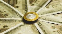 Rupee settles at an all-time low of 87.60, down 18 paise