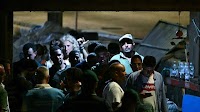 Italian authorities try to identify Lampedusa capsize victims