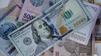 US dollar falls to two-year low against UZS