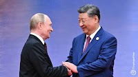 Putin confirms Russia and China are developing settlement systems together