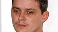 Former News of the World employee accused of bribing prison guard