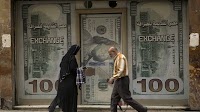 Egypt floats its currency and agrees with the IMF to increase a bailout loan to $8 billion