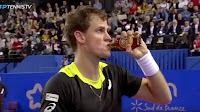 Canadian tennis player Vasek Pospisil sips maple syrup during match