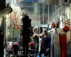 Image of Carnaby Street in 1969, showing a shop window with mannequins dressed in the latest fashion