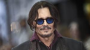 Johnny Depp Earns Huge CinemaCon Applause and Debuts Scrooge Transformation in ‘A Christmas Carol’ First Footage