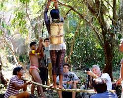 Imagem de group of indigenous people using virtual reality headsets to experience a traditional ceremony