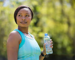 Image of person holding a water bottle