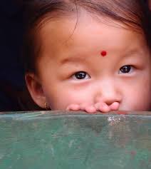 First Place: Kirk Dearden (Associate Professor, Global Health)—Girl at Doorway. kirk_dearden_photo14_website. Sankhuwasabha, Nepal - kirk_dearden_photo14