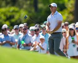 The Masters day two: McIlroy and Reed battle for lead as English trio climb – live