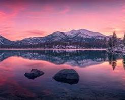 Image of sunset over Lake Tahoe, with vibrant colors reflecting on the water