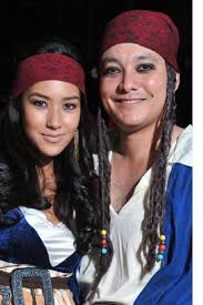 Mikaela and Chucho Martinez set sail in matching pirate costumes, smutty black liner lending a very Jack Sparrow touch to their campy outfits. - 2