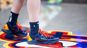Caitlin Clark gifting basketball shoes