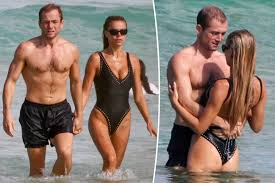 Brooks Nader and Taron Egerton take a dip during romantic Australia beach date