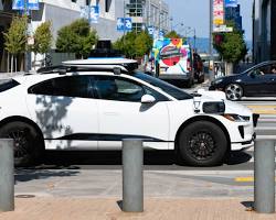 Image of Waymo selfdriving car on city street