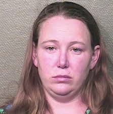 Amy Dawn Cooney, 31, has been charged with endangering a child after leaving her son in a car while she visited a bar - article-2201299-14F2AD18000005DC-638_468x476