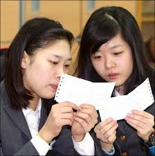 Photo of the Day: College Entrance Exam Results Announced. » by GI Korea in: Picture of the Day. Critical moment: Two senior high school students at Dunsan ... - n4