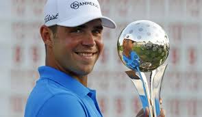 Gary Woodland celebrates with his trophy after winning the 2011 Transitions Championship. - woodland-golf-2_t640