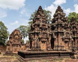 Close-up of the intricate pink sandstone carvings at Banteay Srei temple.