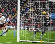 Image of Emiliano Martinez of Aston Villa making a save against Manchester City