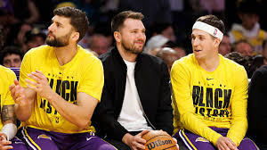 Dončić watches from the sidelines as the Lakers rout his former team