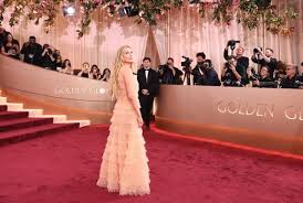 Zoë Kravitz Is at the Golden Globes Wearing a Peach Satin Slip With Lil Lace Details