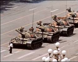 Image of Person standing in front of tank