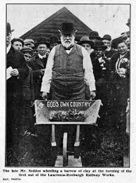 Richard John Seddon wheeling a barrow of clay at the turning of the first sod of the Lawrence-Roxburgh railway works - S052_2-058363seddon