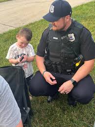 Springboro - Officer Hurles enjoyed stopping by a block party and letting his new friend check out some of his equipment. | Facebook