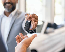 Image of someone handing over car keys