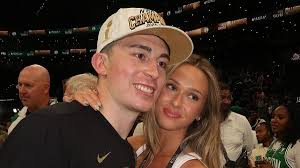 Payton Pritchard's wife captures touching moment NBA champion sneaks off 
during dog walk to surprise young fan