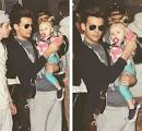 Harry Styles Snapped Shirtless Holding Baby Lux With His Many
