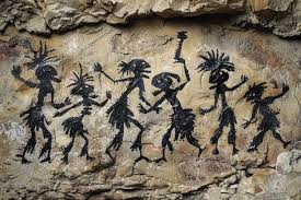 Ancient cave paintings depicting tribal dance | Premium AI-generated image