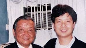 Wai Hang Hei and Mr. Leung Yat Chiu, harmonica instructor. 1988. - pym04