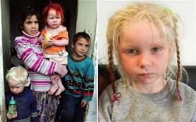 ... children pose for photographers in the town of Nikolaevo, Bulgaria and (right) Maria who was found in a Roma ghetto in Greece Photo: EPA/IVAN YANEV - maria-bulgaria8_2712535b
