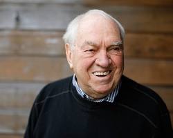 Image of Ed Broadbent with an award