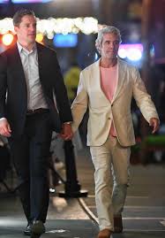 Andy Cohen sparks romance rumors as he holds hands with hunky finance exec, 42, at his 58th birthday dinner