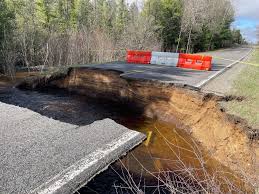 Section of 11 Mile Road washed away; historic flooding possible this week