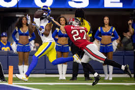 Davante Adams showcasing football techniques to Sean McVay