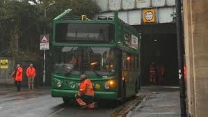 Newport school bus crashes into railway bridge injuring three children - BBC