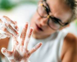 Image of Person washing hands repeatedly