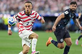 United States\' Sergino Dest, left, controls a ball next to Paraguay\'s Omar Alderete during the World Cup Group D soccer match in Inglewood, California on June 12.